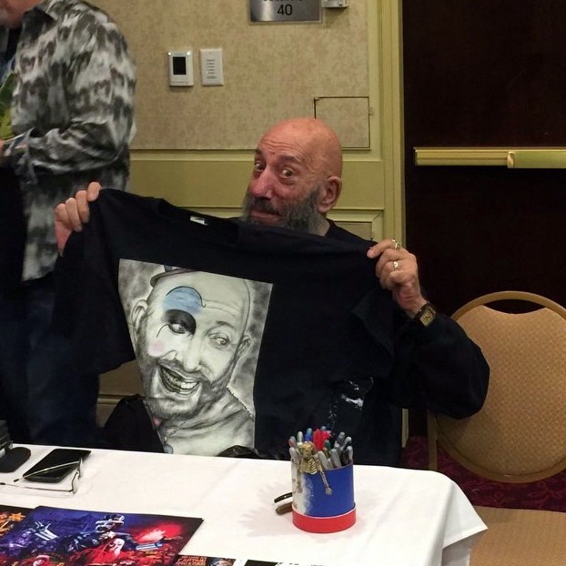 Actor Sid Haig holds up his Living Dead Girl Nicole shirt